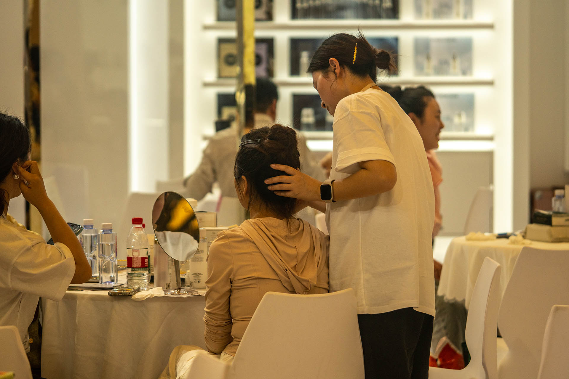 Female visitor receives sample cosmetic treatment at CBE