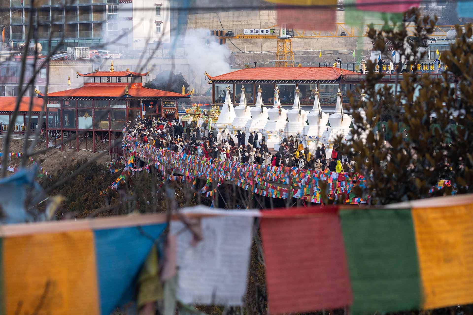 Crowd gathered in front of valley with mountain view
