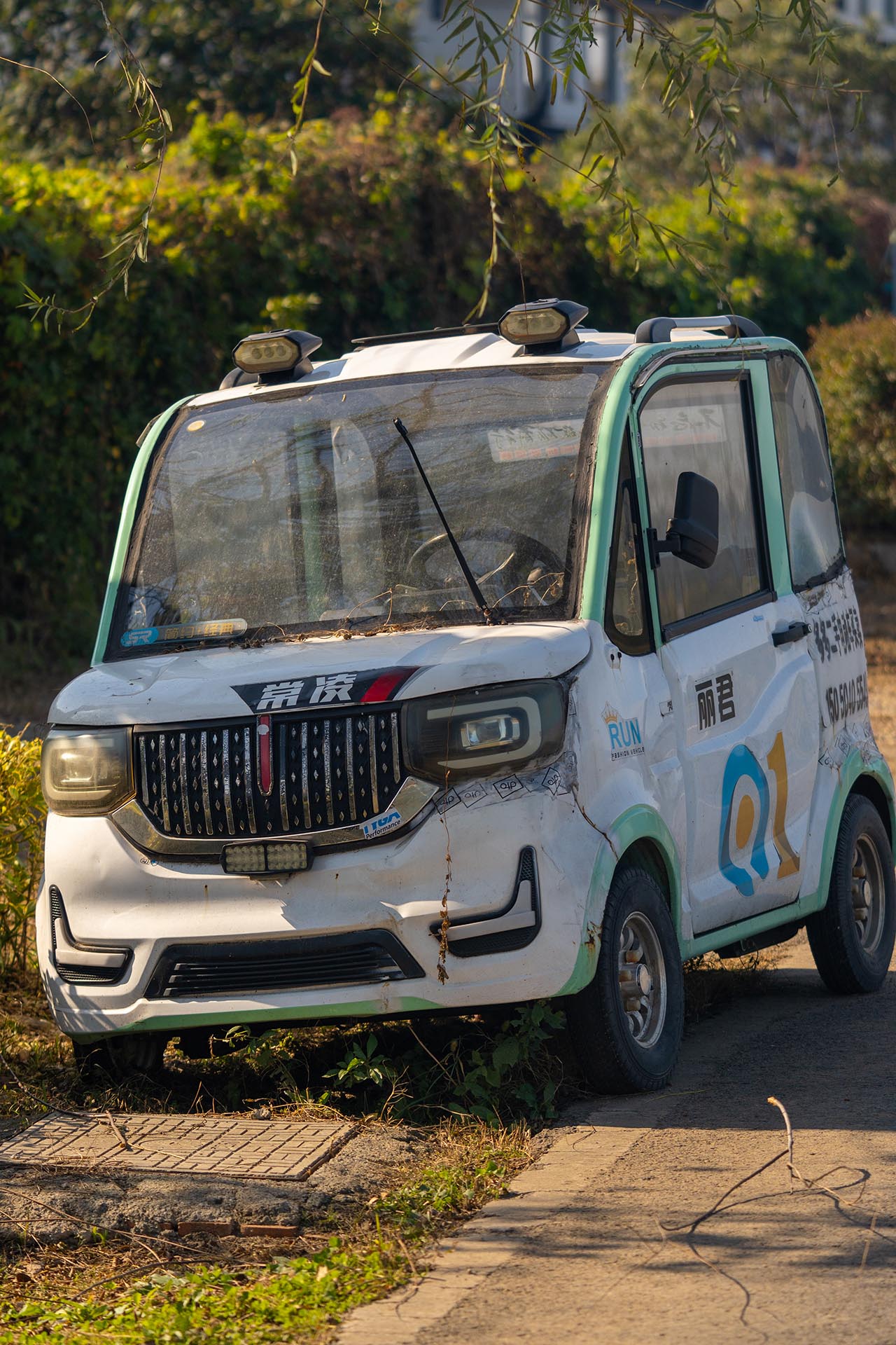 Abandoned electric car left in outdoor area
